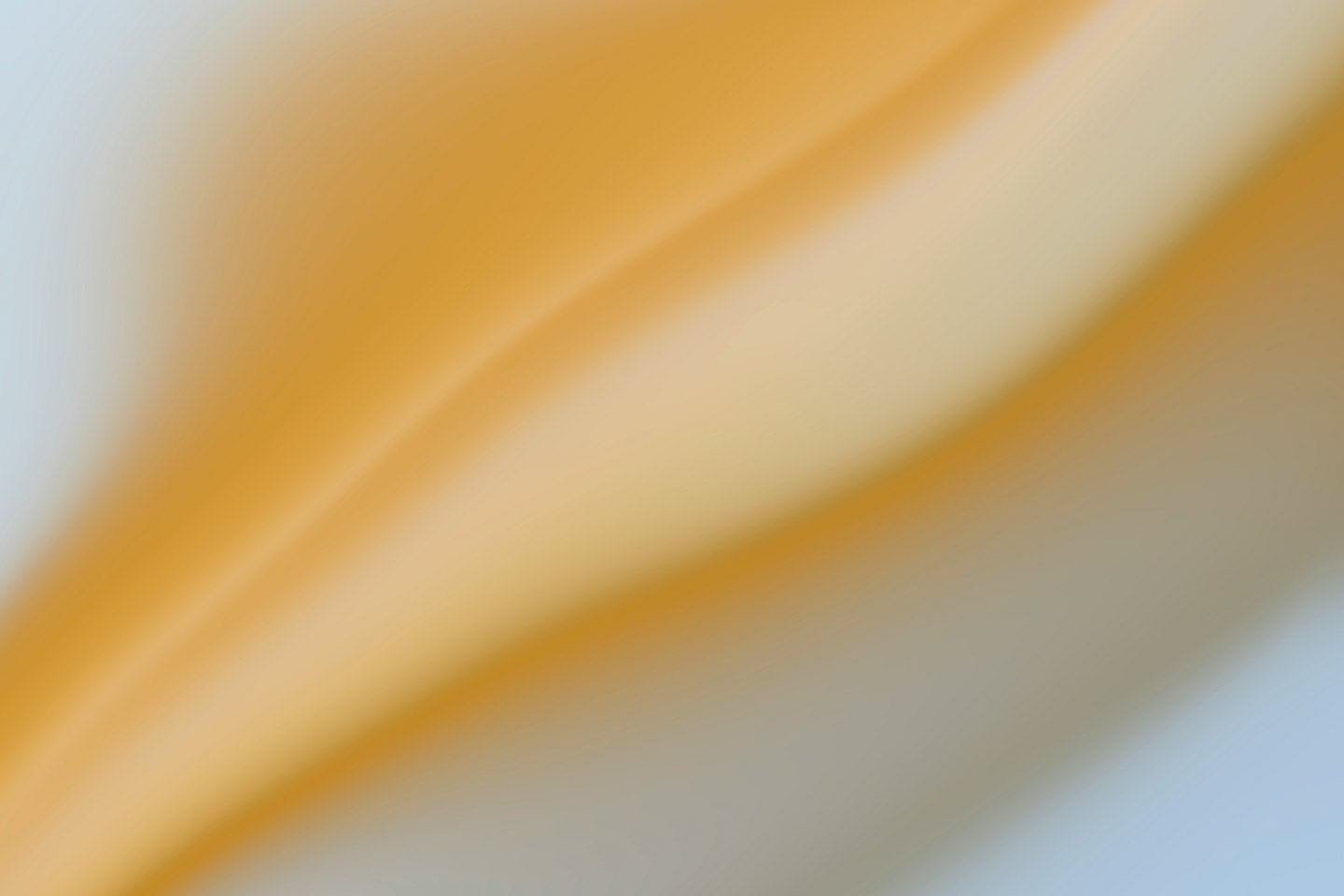 Flowing gold and blue abstract gradients resembling fabric folds.